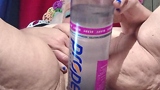 Big Bottle Plugged Clit Cunt