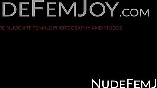 Lovely brunette Katrine Pirs takes off her clothes under a nig tree