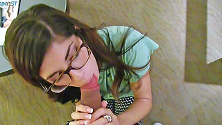 Ava Taylor wears her glasses while she plays with a cock