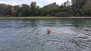 Sexy Granny Swims Naked in a Lake!