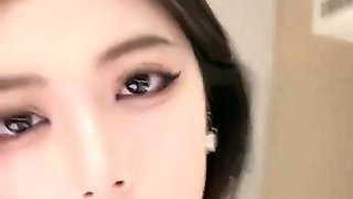 Asian babe sucking and jerking two hard dicks
