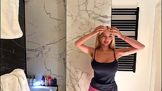 Big tits big ass hot sexy beauty in the bathroom with the short pink skirt shows her braless boobs and long legs