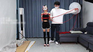A Young, Beautiful, Slender, and Adorable Girlfriend, with Black Stockings, Red Strings, and Restraints