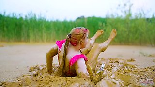 German teen masturbates to orgasm in muddy lake - wet and messy solo fingering
