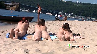 Wicked young nudist enjoys being topless at the beach