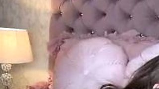 Brunette seductress working her big boobs and hot ass