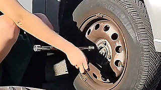 Dirndl Slut Gets Dirty and Oily Changing Tires