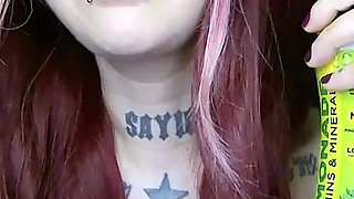 Sexy Alternative Redhead Drinking Soda and Burping