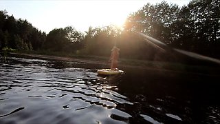 Tattooed Babe Strips and Swims on a SUP Board in the Forest