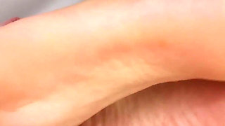 Beautiful Brunette Giving a Footjob POV