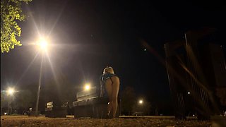Changing outfit in public park at night and flashing naked.