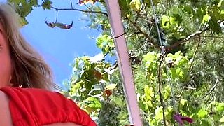 Blonde is flashing her big boobs in the outdoors
