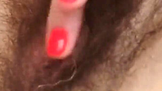An Extremely Hairy Brunette Finger Masturbates a Pussy From Which Big Labia Stick Out MILF Ginnagg